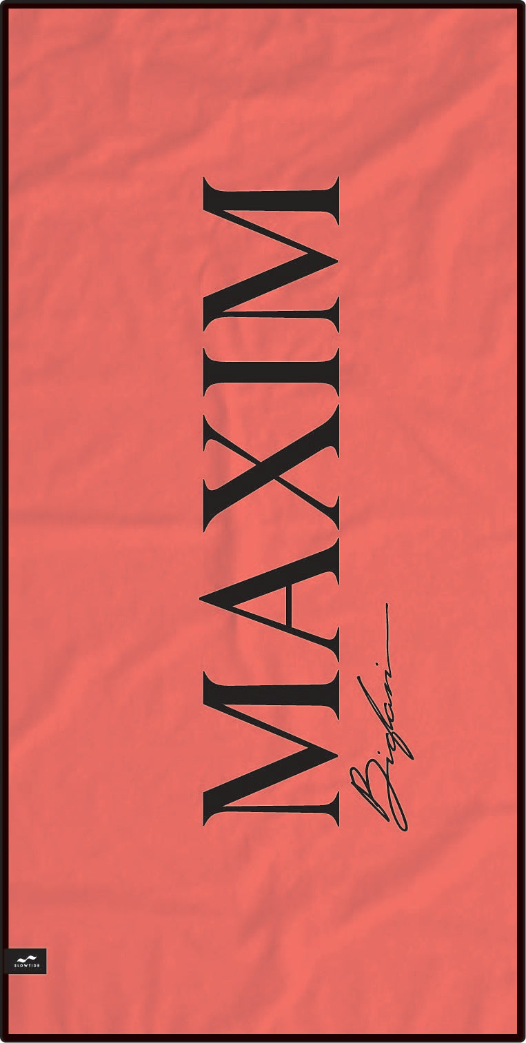 backside of beach towel is all red with maxim logo 